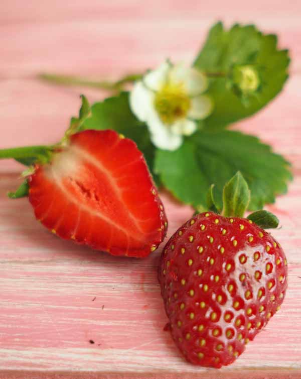use strawberries to naturally whiten your teeth