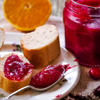 Christmas Cranberry curd with bread and spoon