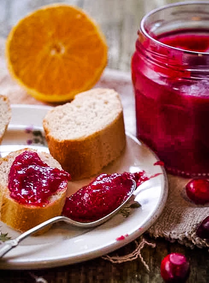 Christmas Cranberry curd with bread and spoon