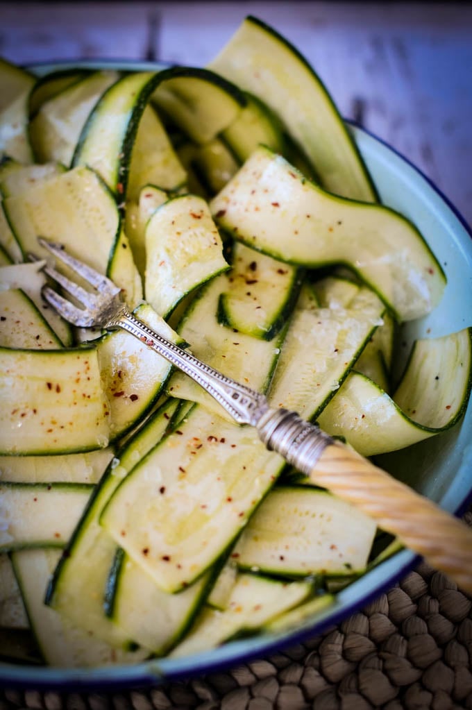 strips of courgettes with fork