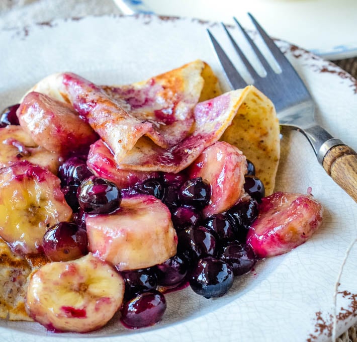 close up of blueberry and banan crepes