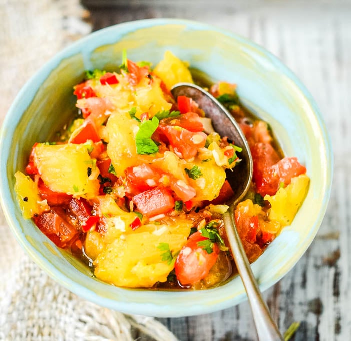 pineapple salsa close up of bowl with spoon