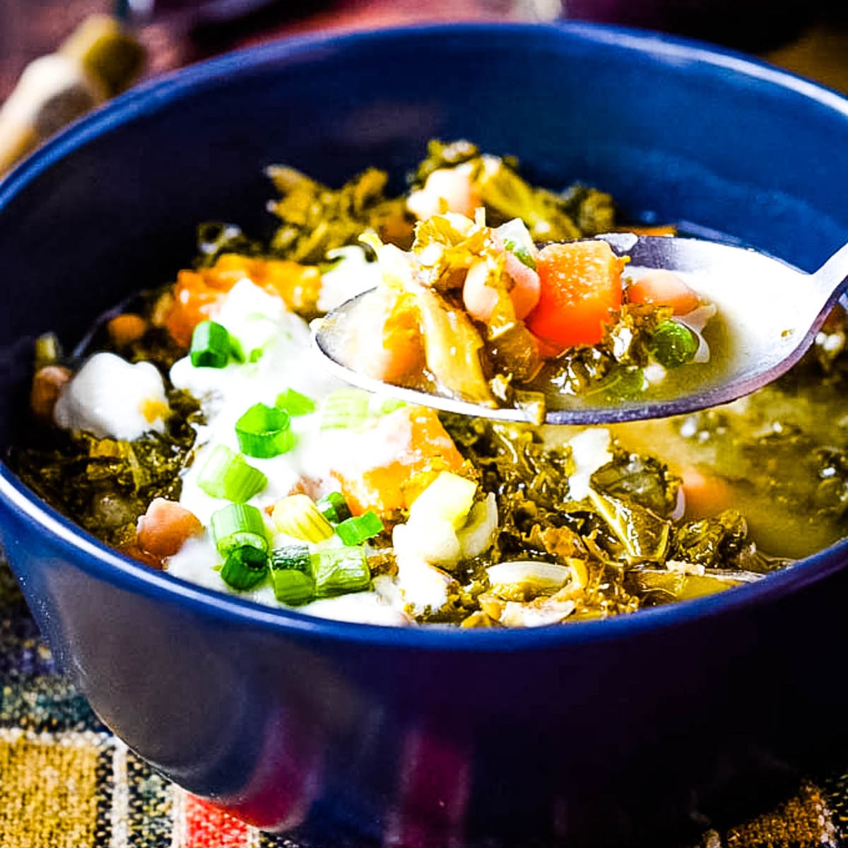 bowl of squash kale and chickpea soup