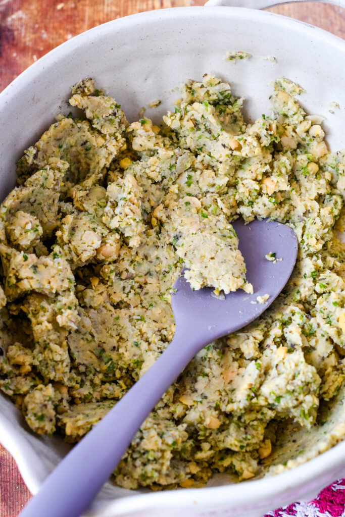 mixing the mashed chickpeas with the mix from food processor