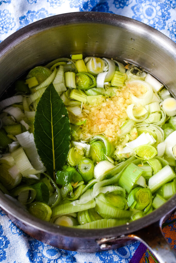 heating the vegetables with water in a pan