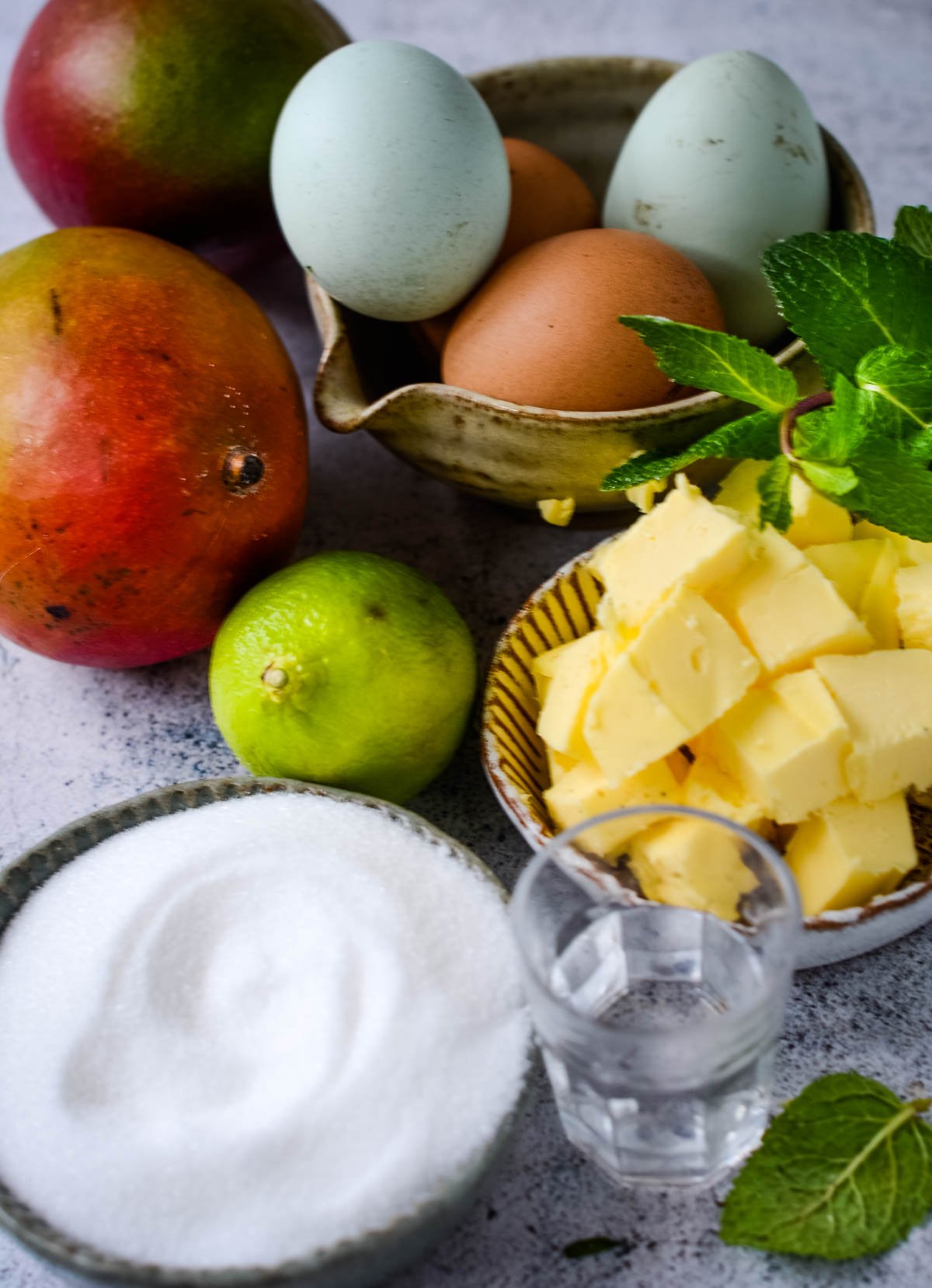 ingredients for lime and mango curd on table
