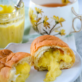 mango and lime mojito curd in a croissant with jar and cup behind
