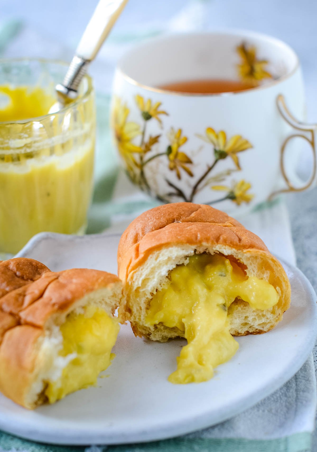 mango and lime mojito curd in a croissant with jar and cup behind