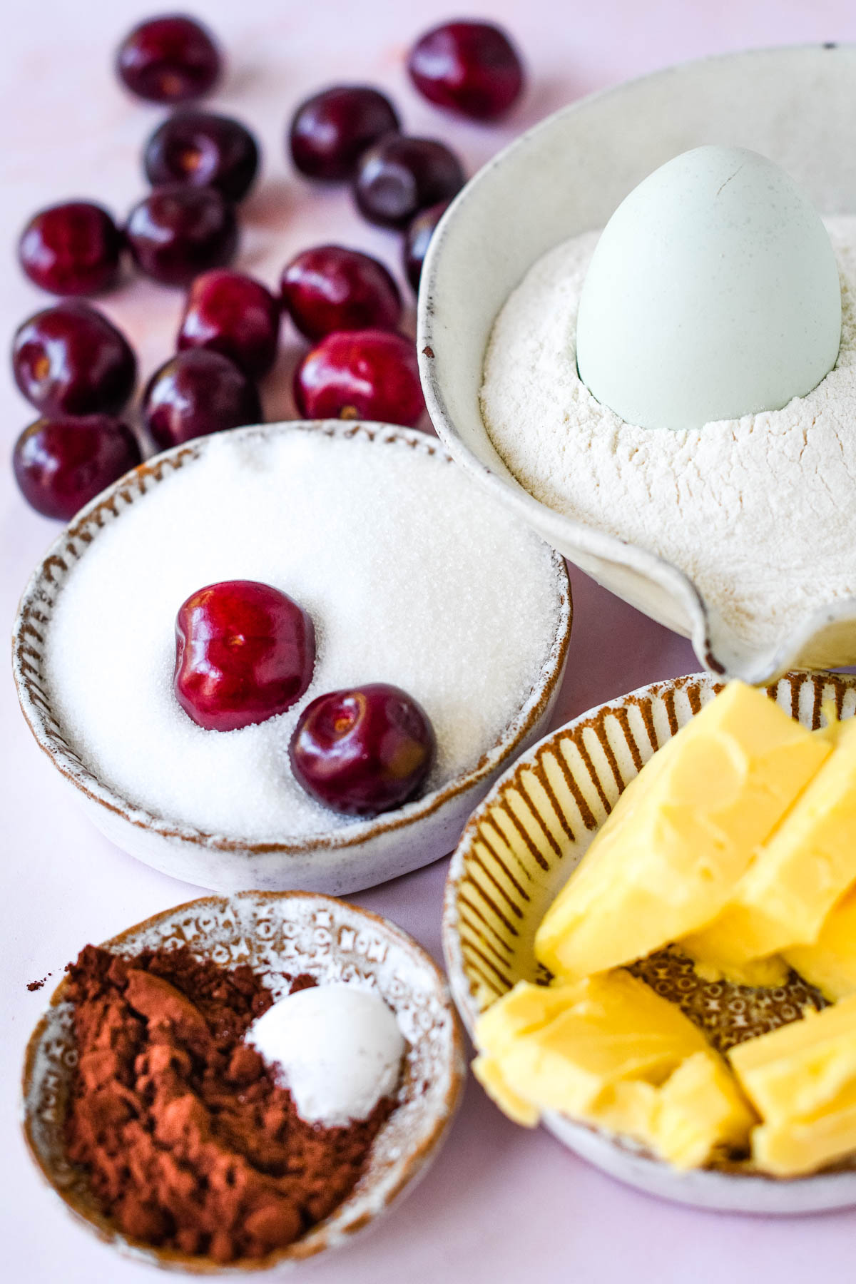 Ingredients for chocolate cherry cake on table