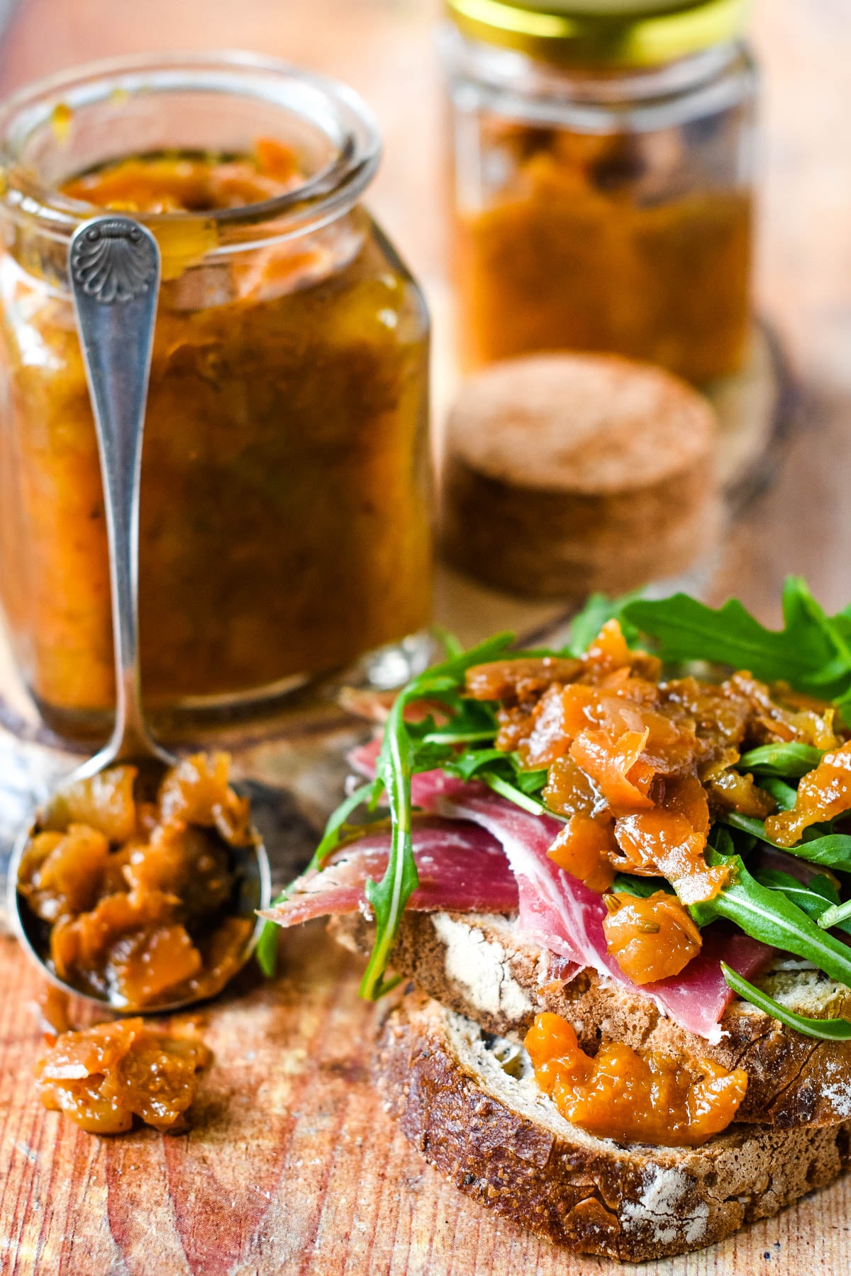 jars of carrot peel chutney with sandwich in front