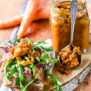 carrot peel chutney with salad in front of jar and spoon