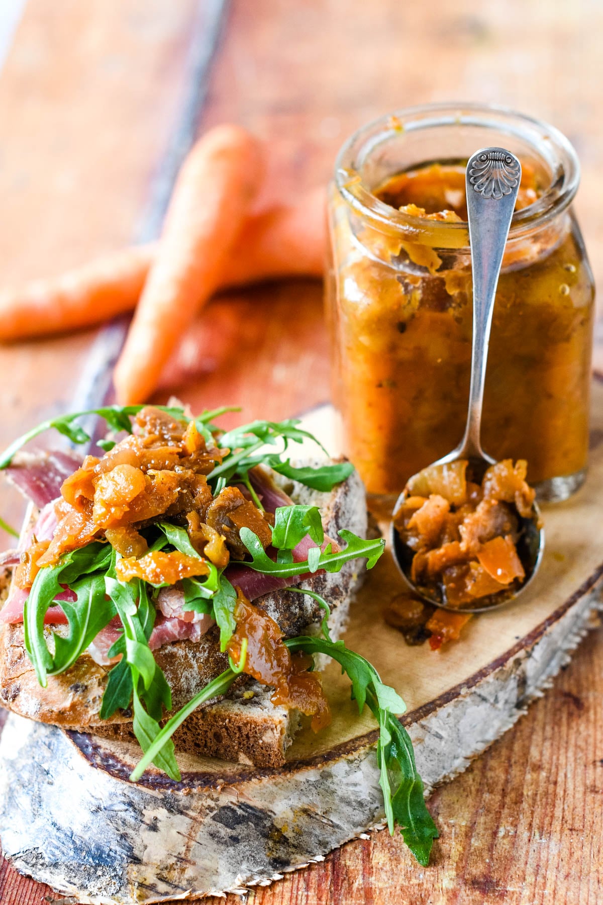 carrot peel chutney with salad in front of jar and spoon