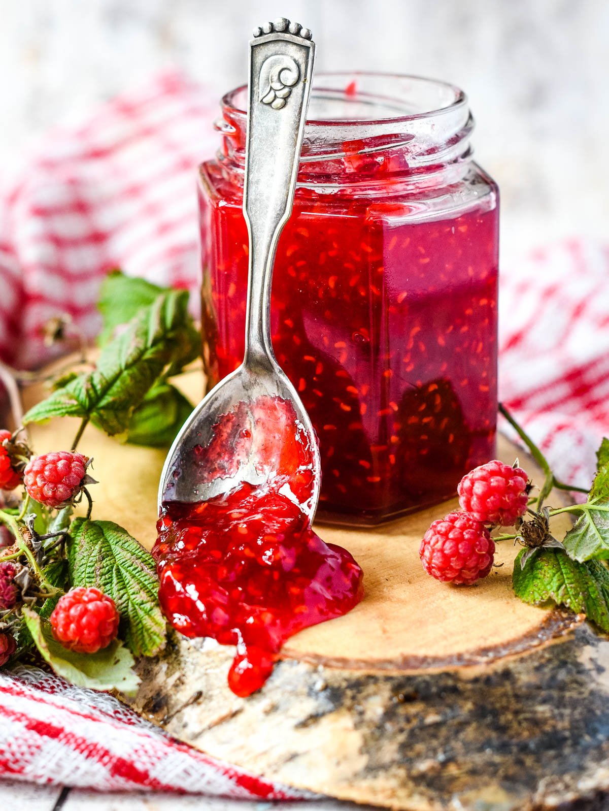 raspberry jam in jar with vintage spoon