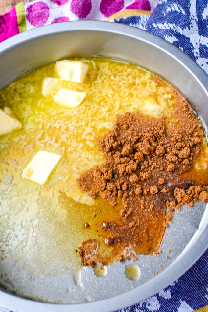 melting butter, maple syrup and spices in baking tin