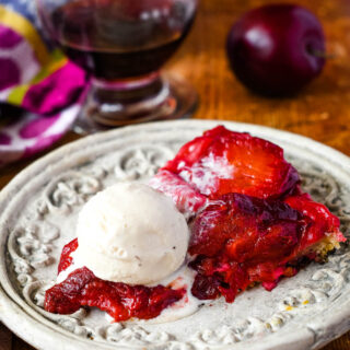slice of plum tarte tatin with ice cream on top