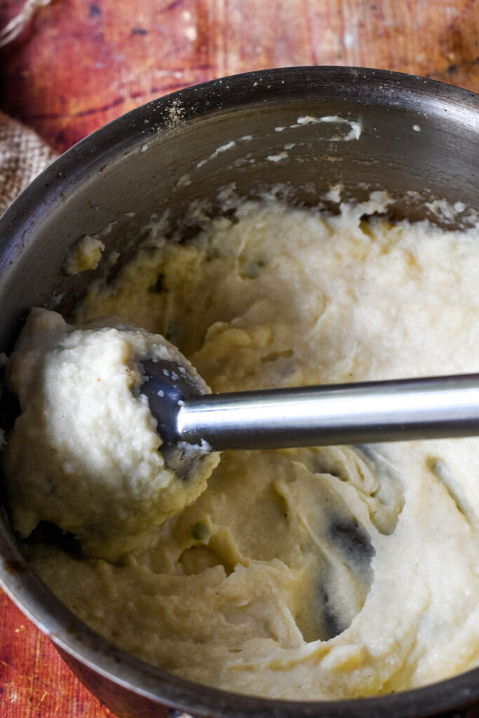 mashing the parsnips with stick blender