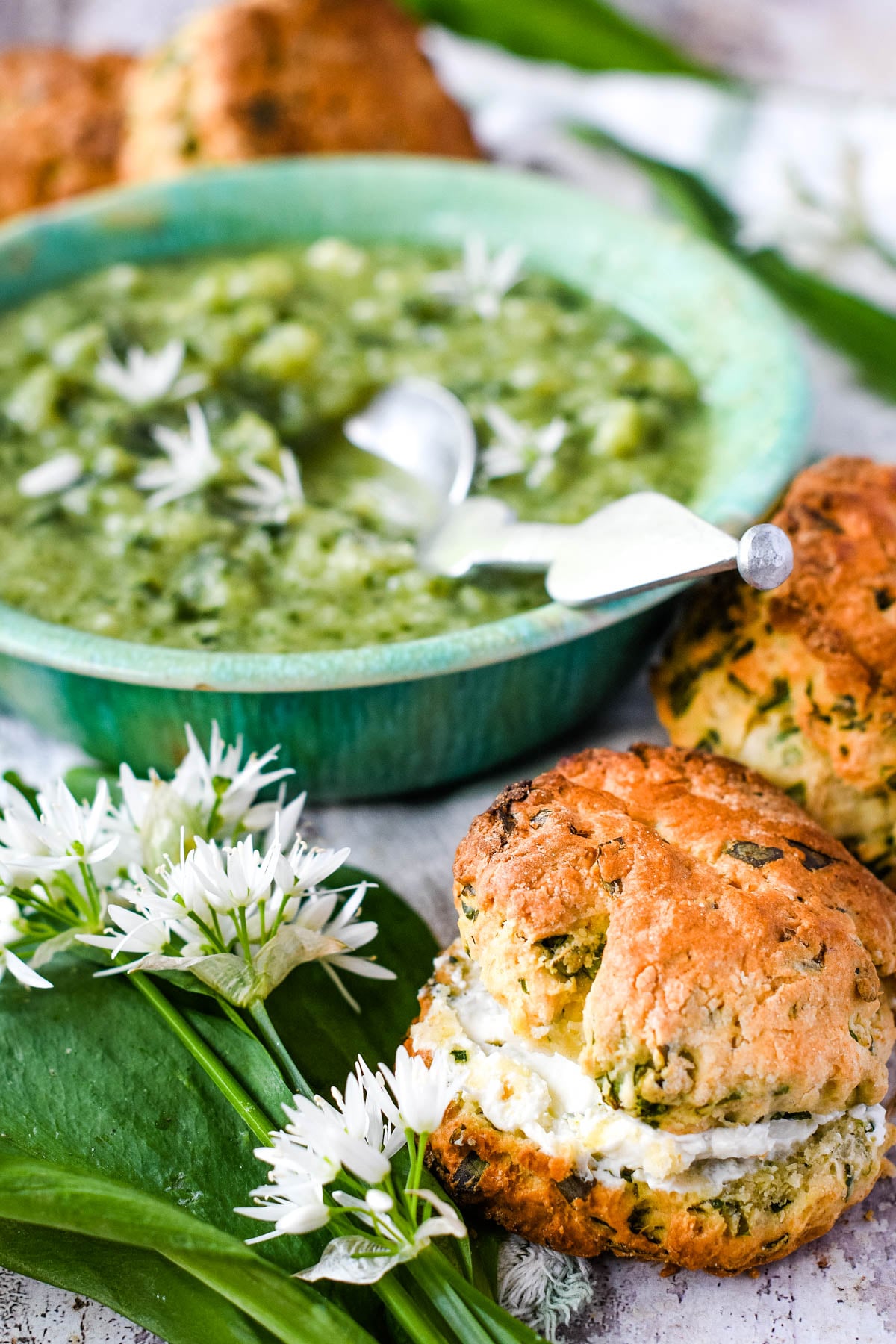 scones with bowl of wild garlic soup behind