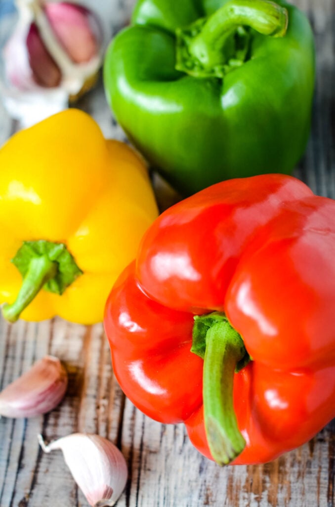 group of coloured peppers and garlic