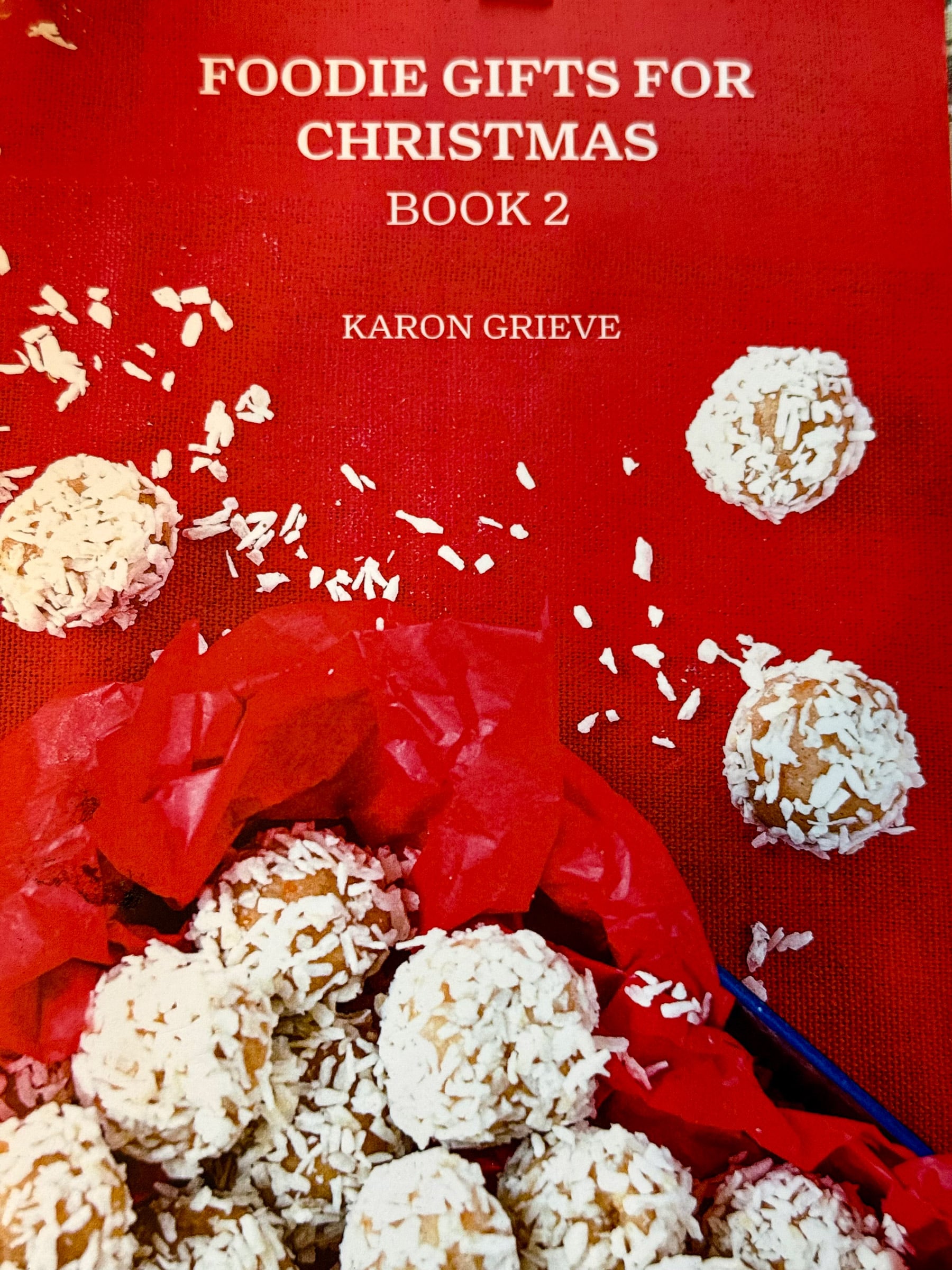 Cover of Karon Grieve’s Foodie Gifts for Christmas Book 2 featuring coconut-coated Christmas treats.