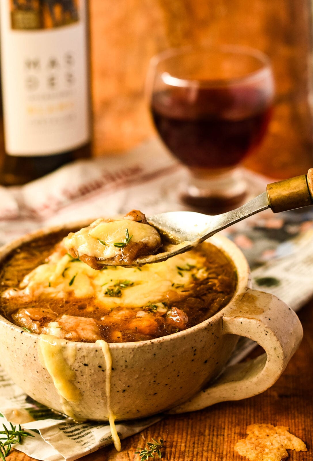 bowl of French onion soup with spoon